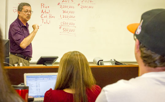 Professor Gene Johnson instructs an accounting class